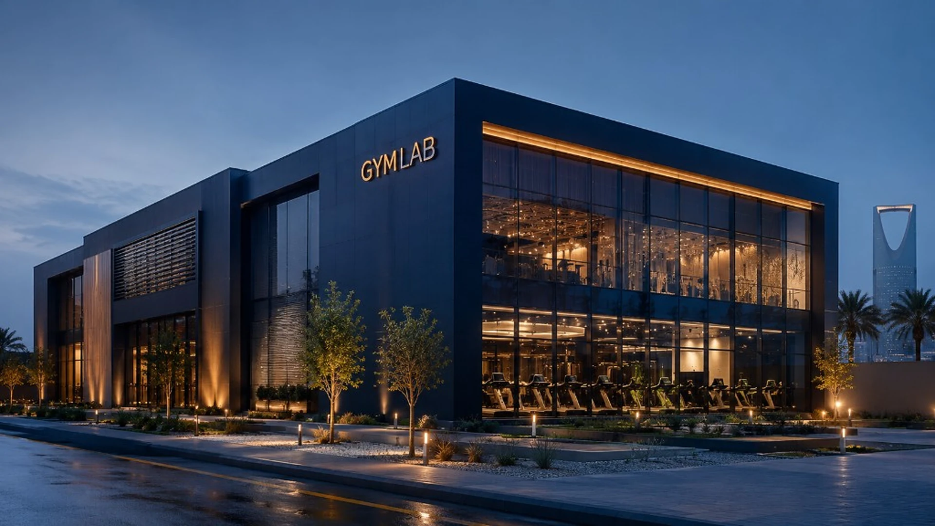 Modern GYMLAB building with glass facades and warm lighting